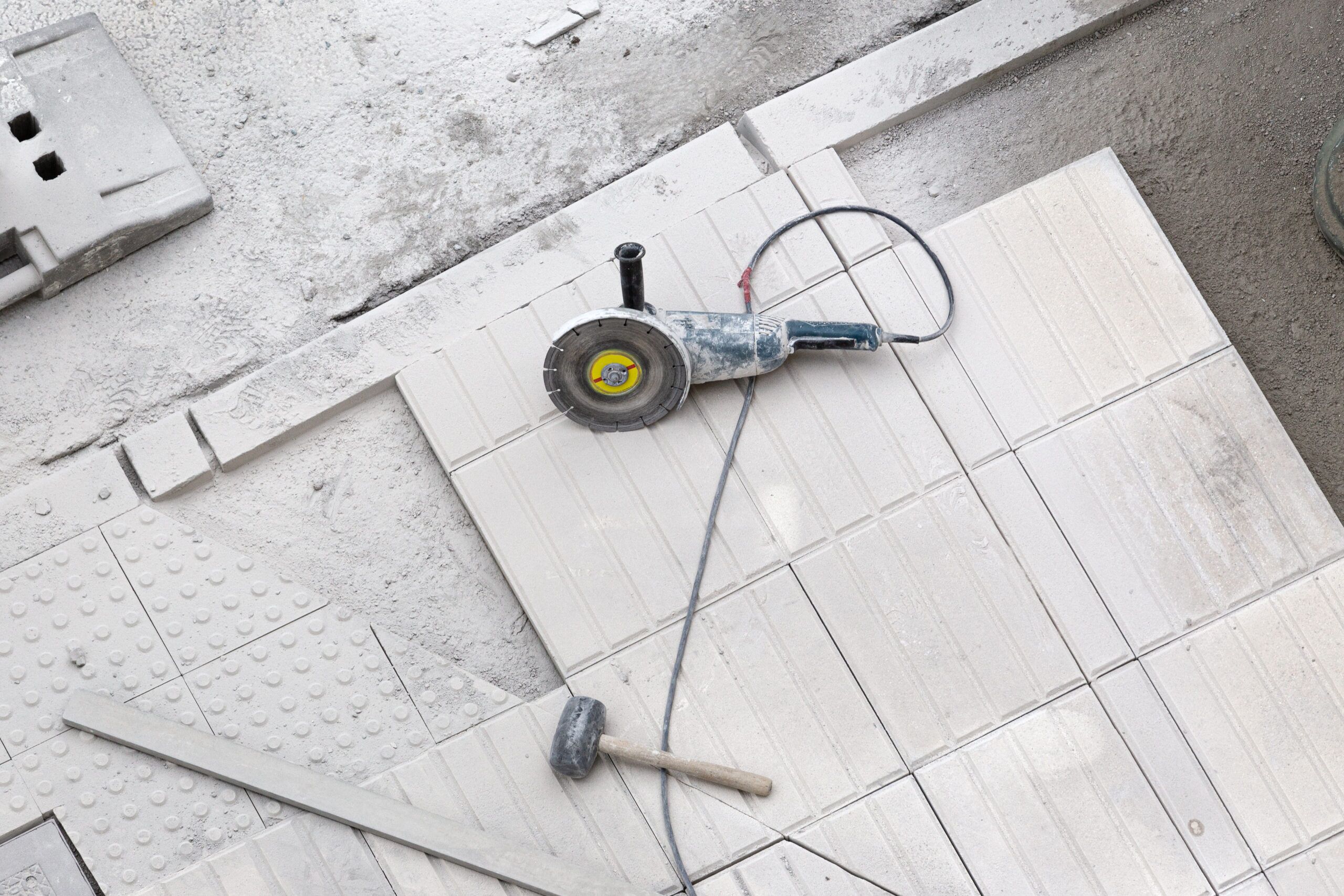 Tile-cutting tools and tile on a work surface
