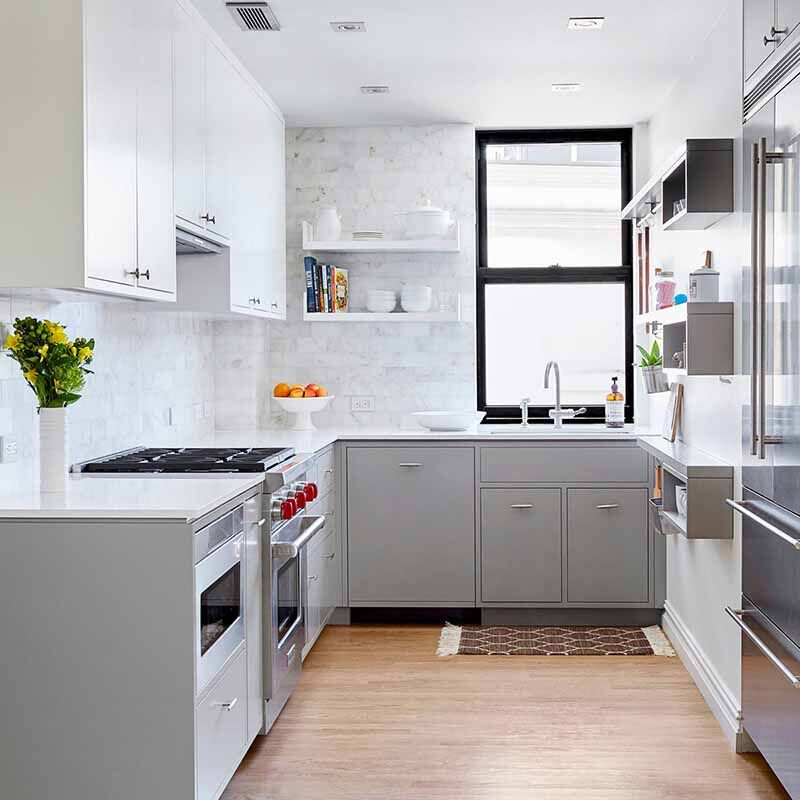 White kitchen with a window and timber flooring