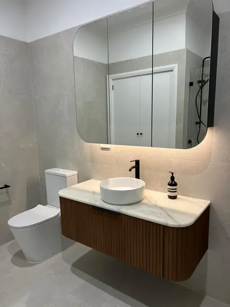 Floating vanity and illuminated mirror