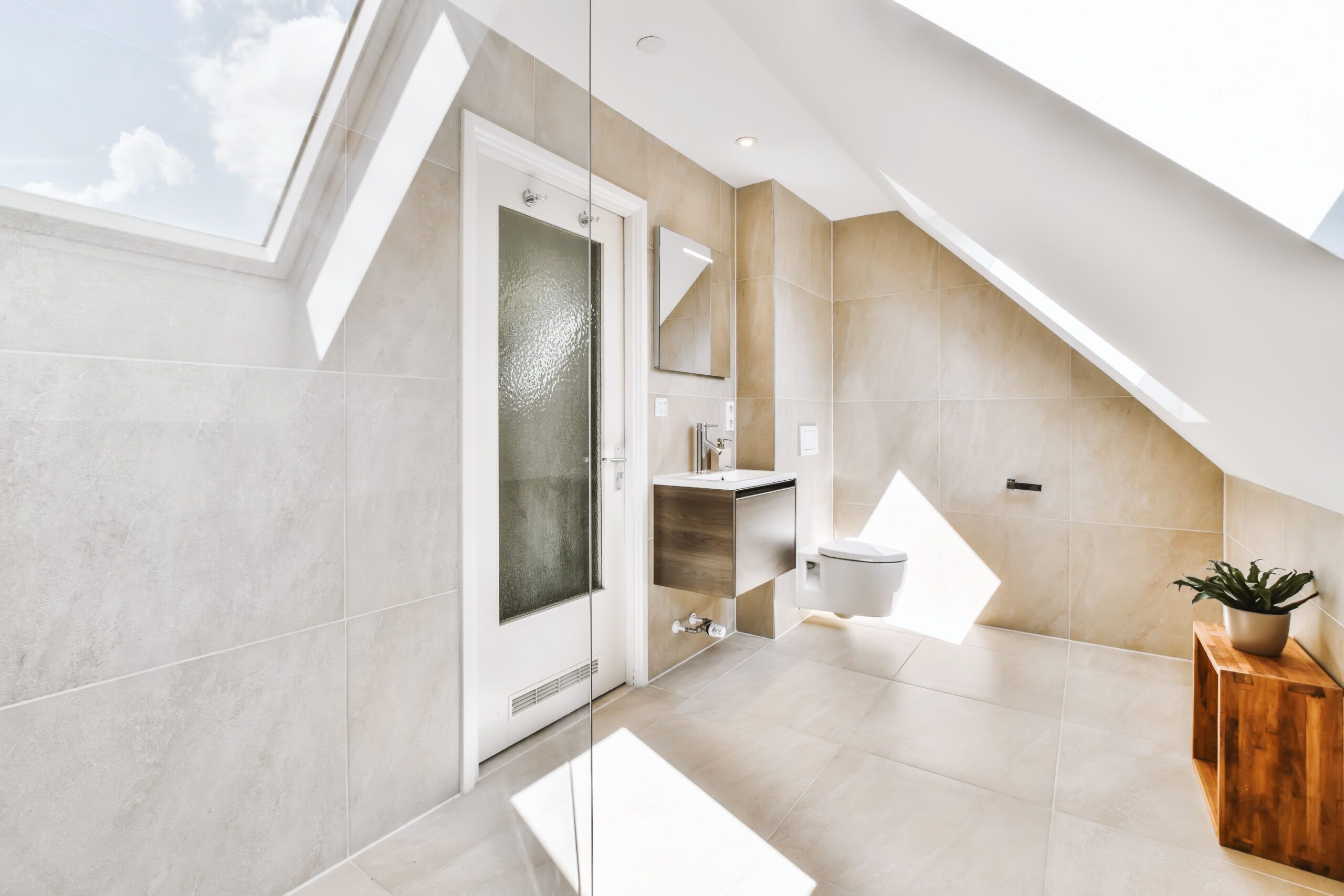 Light bathroom beneath a sloping ceiling